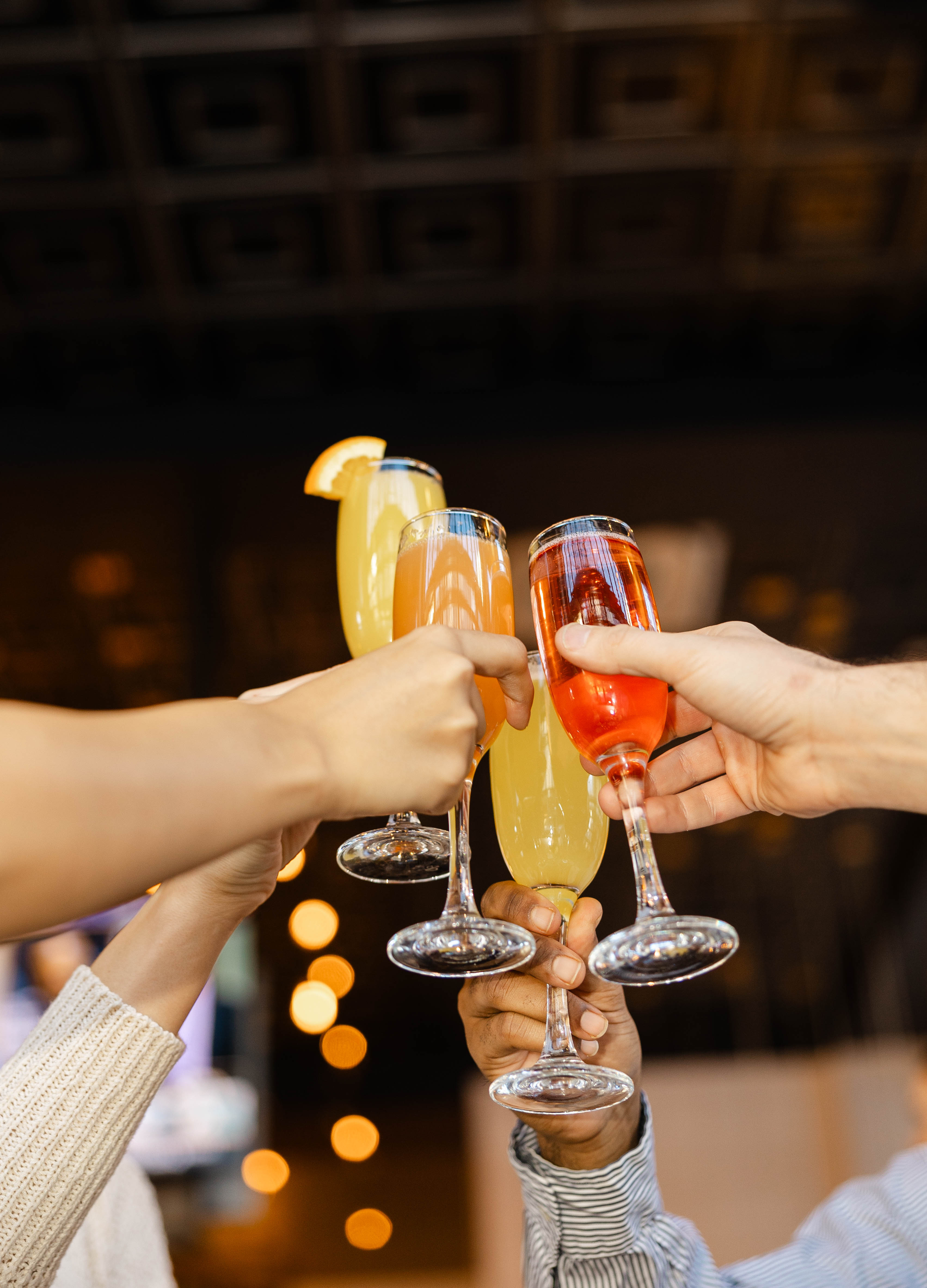 a group of people clinking glasses