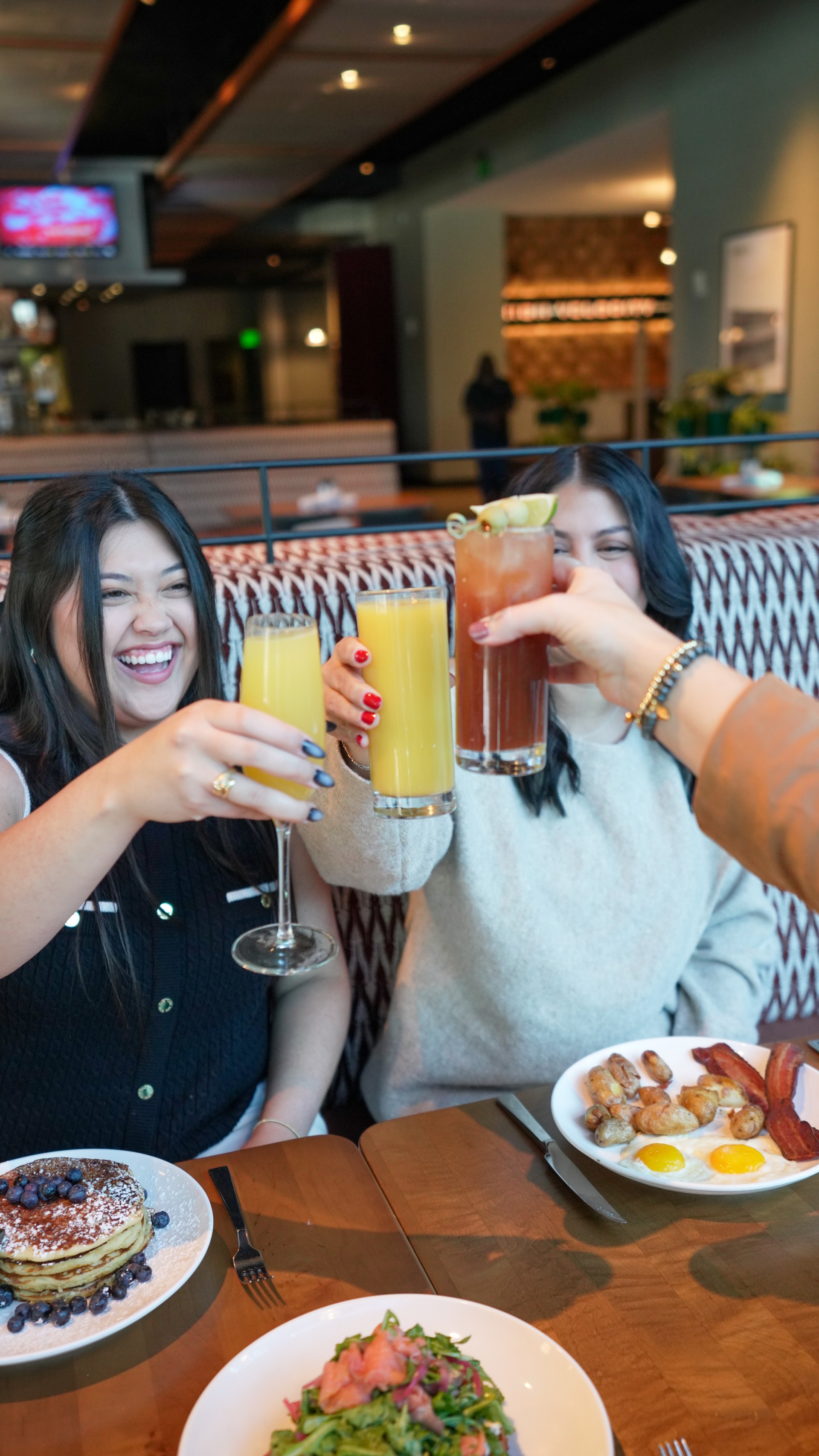 a group of women holding drinks