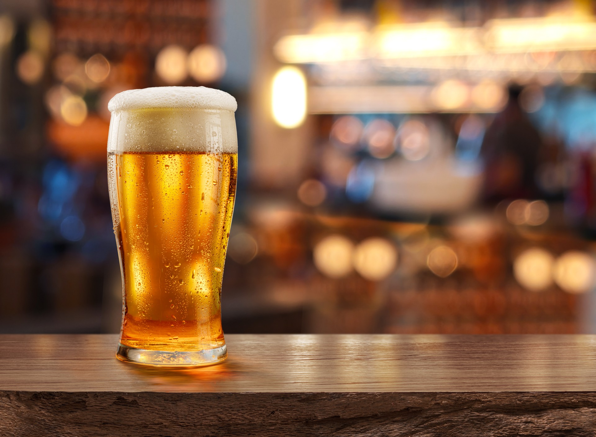a glass of beer on a table