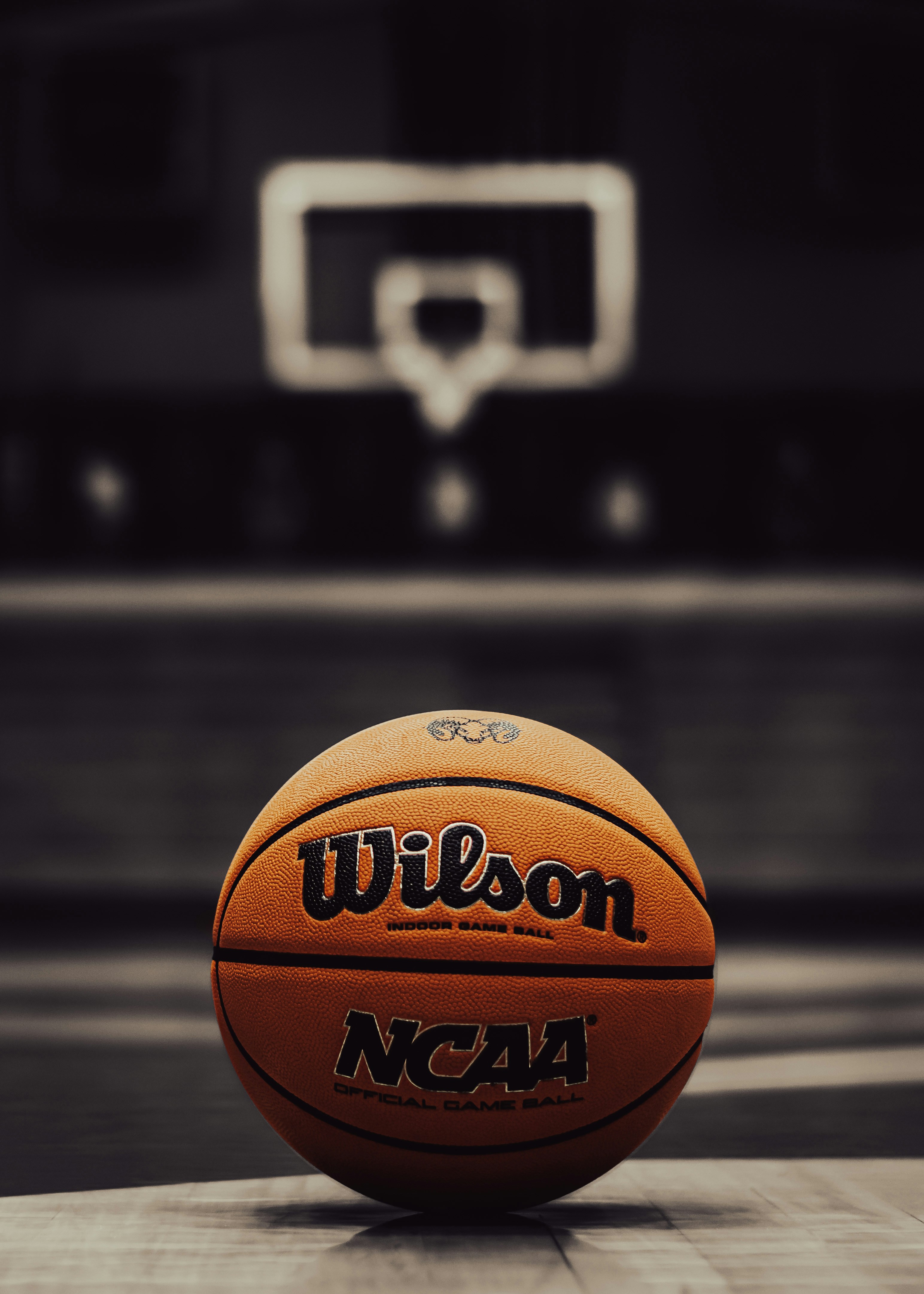 a basketball in front of a basketball hoop