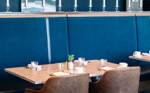 a table with a blue booth