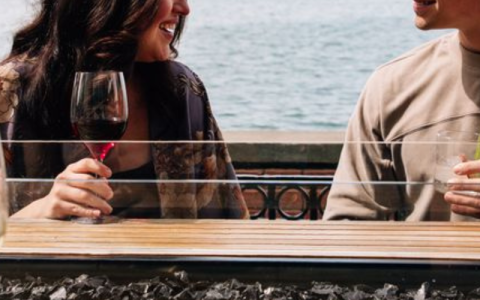 a woman holding a glass of wine