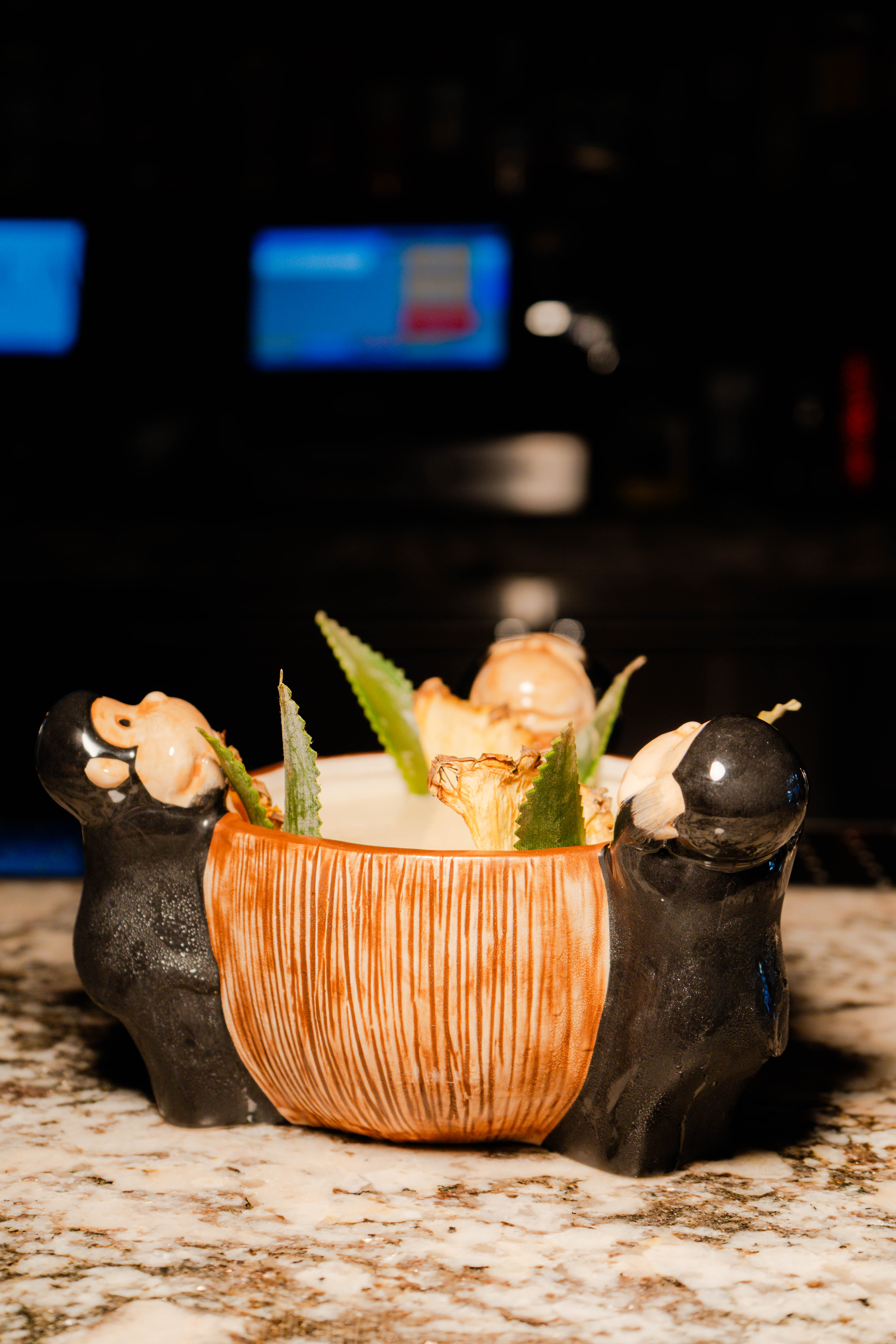 a bowl with two bears inside