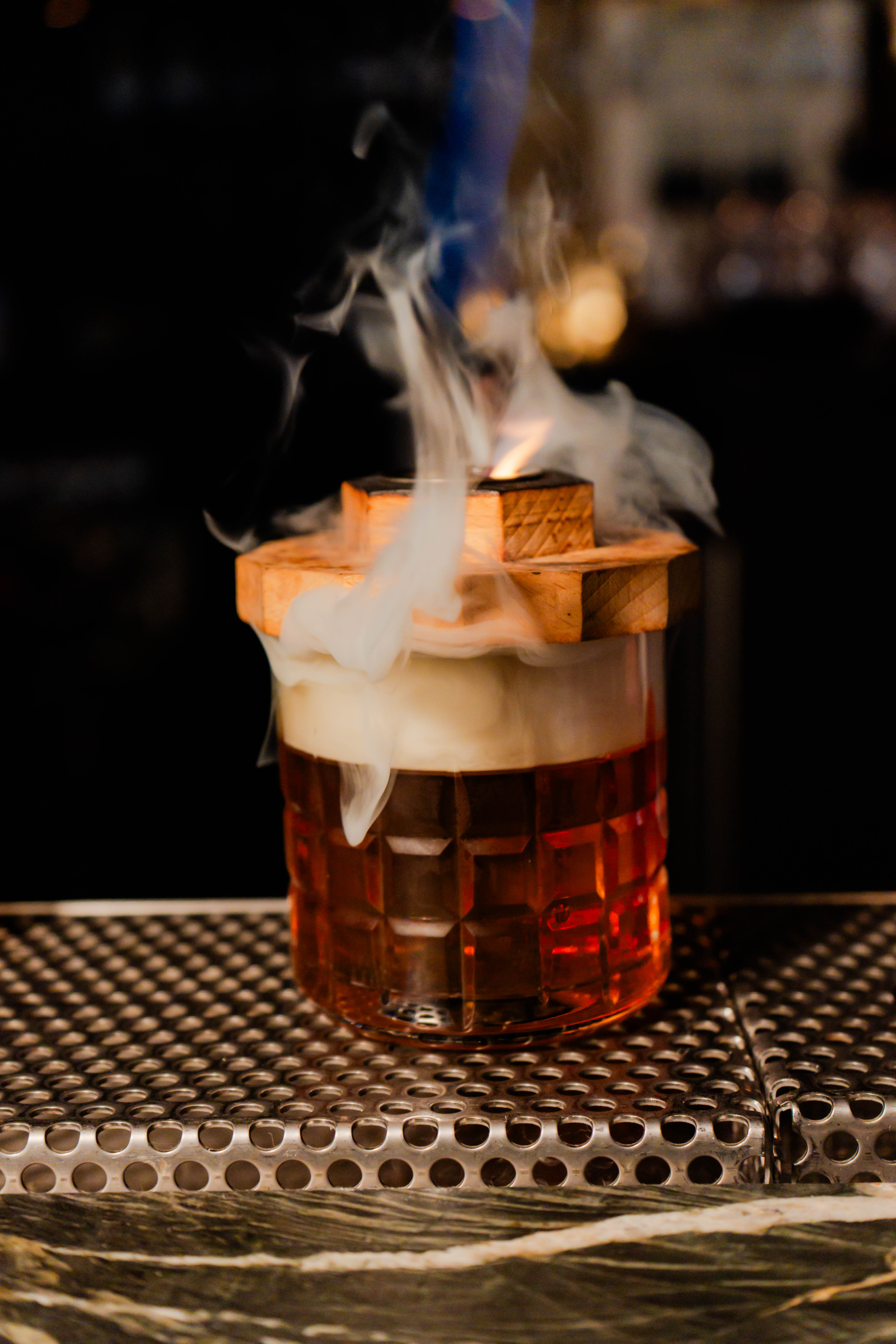 a glass with a drink on it