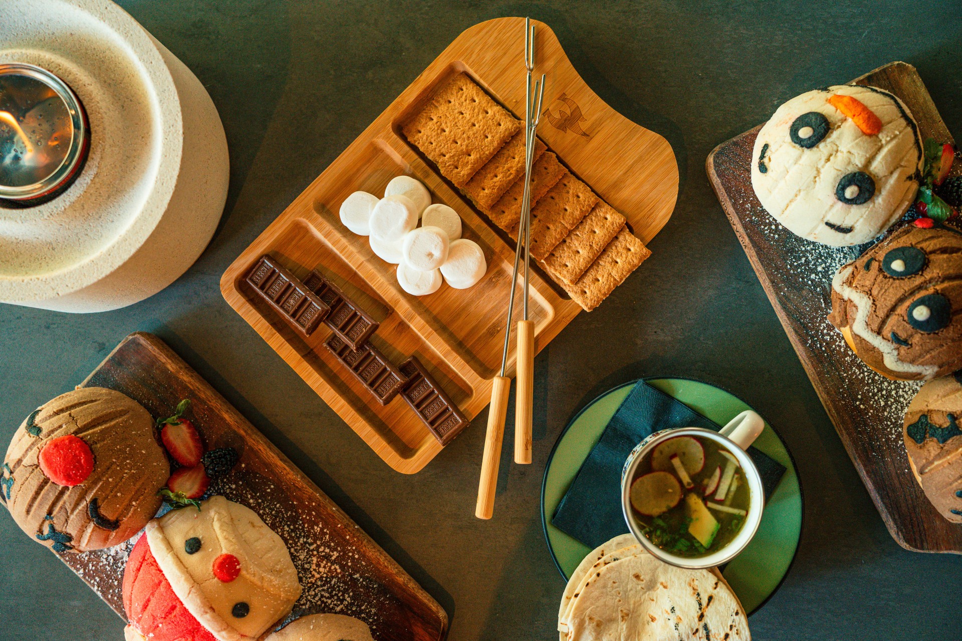 a tray of marshmallows and chocolate on plates