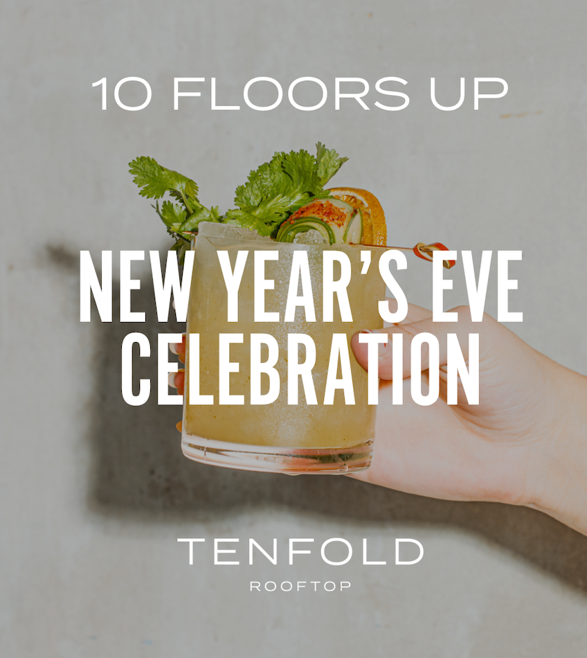 a hand holding a drink