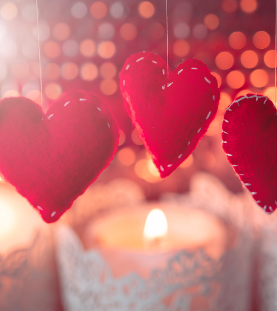 a group of red hearts from strings