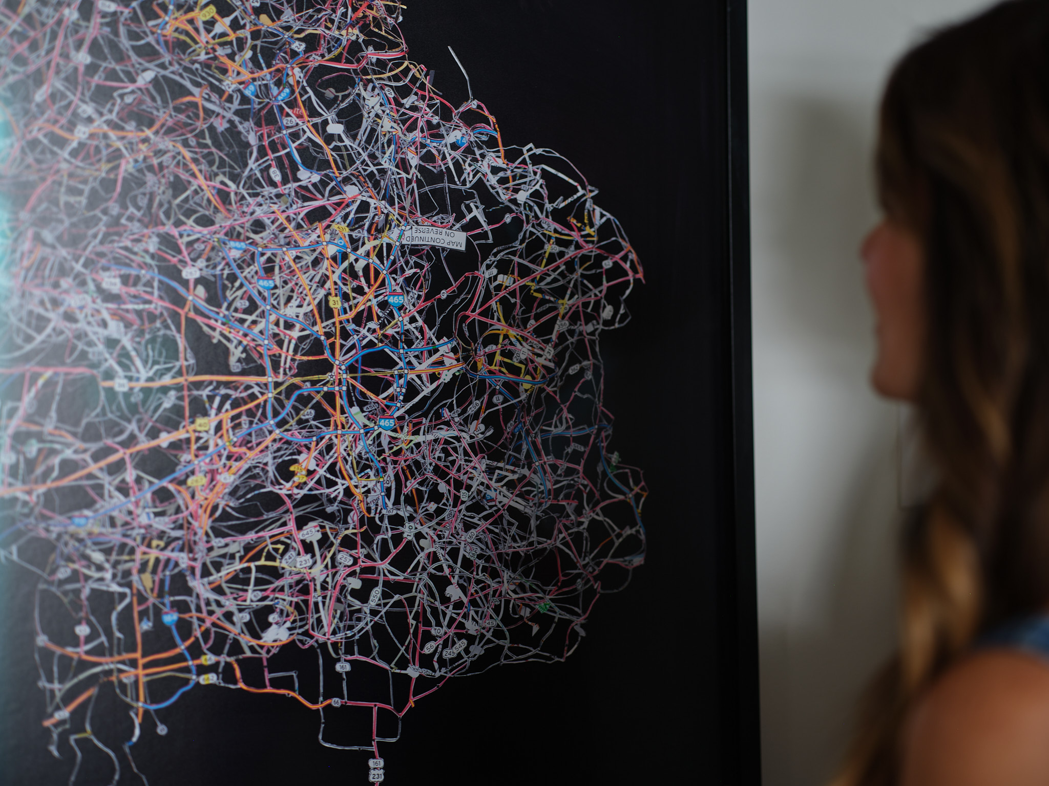 a woman looking at a map