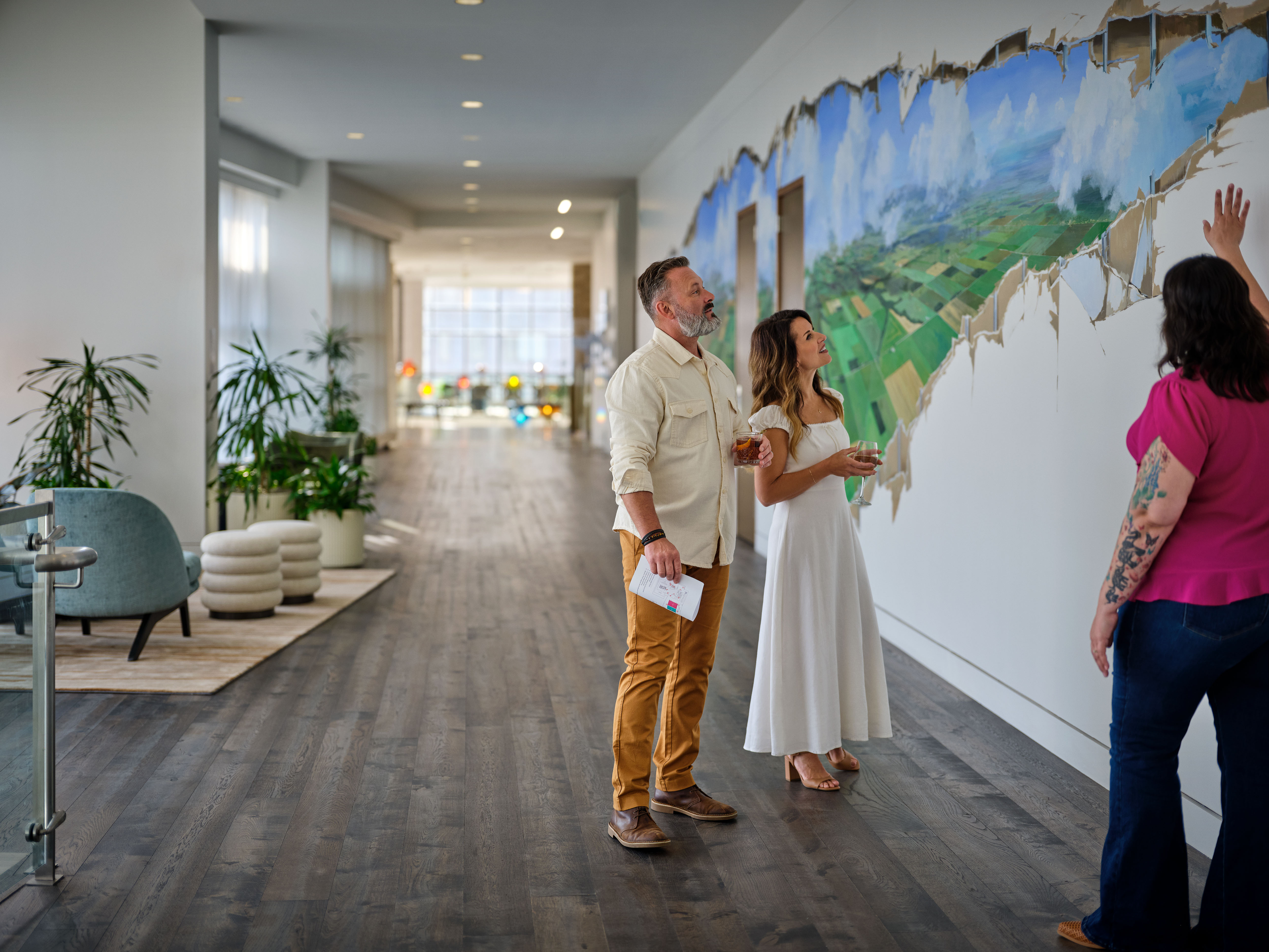 a group of people standing in a hallway