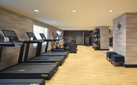 a room with treadmills and exercise equipment