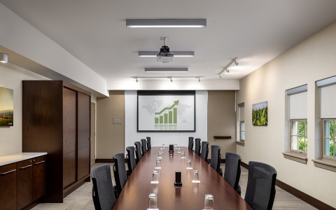 a conference room with a table and chairs