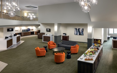 a room with a buffet table and chairs