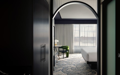 a room with a bed and chair