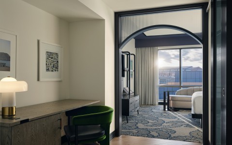 a room with a couch and a desk