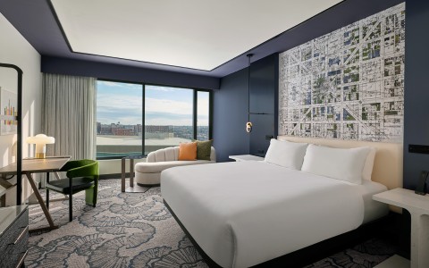 a room with a bed and a chair