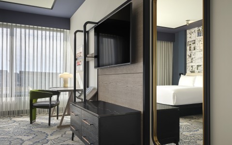 a room with a tv and a bed