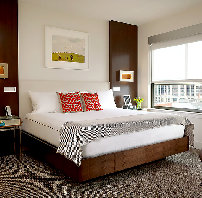 a well decorated room with a large bed