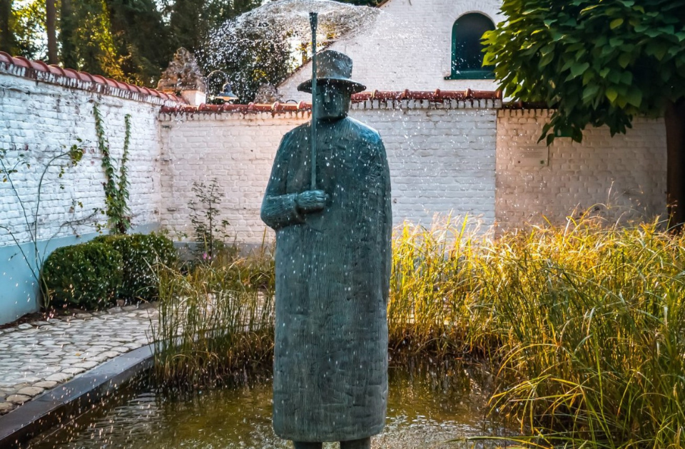 a statue of a man in a water fountain