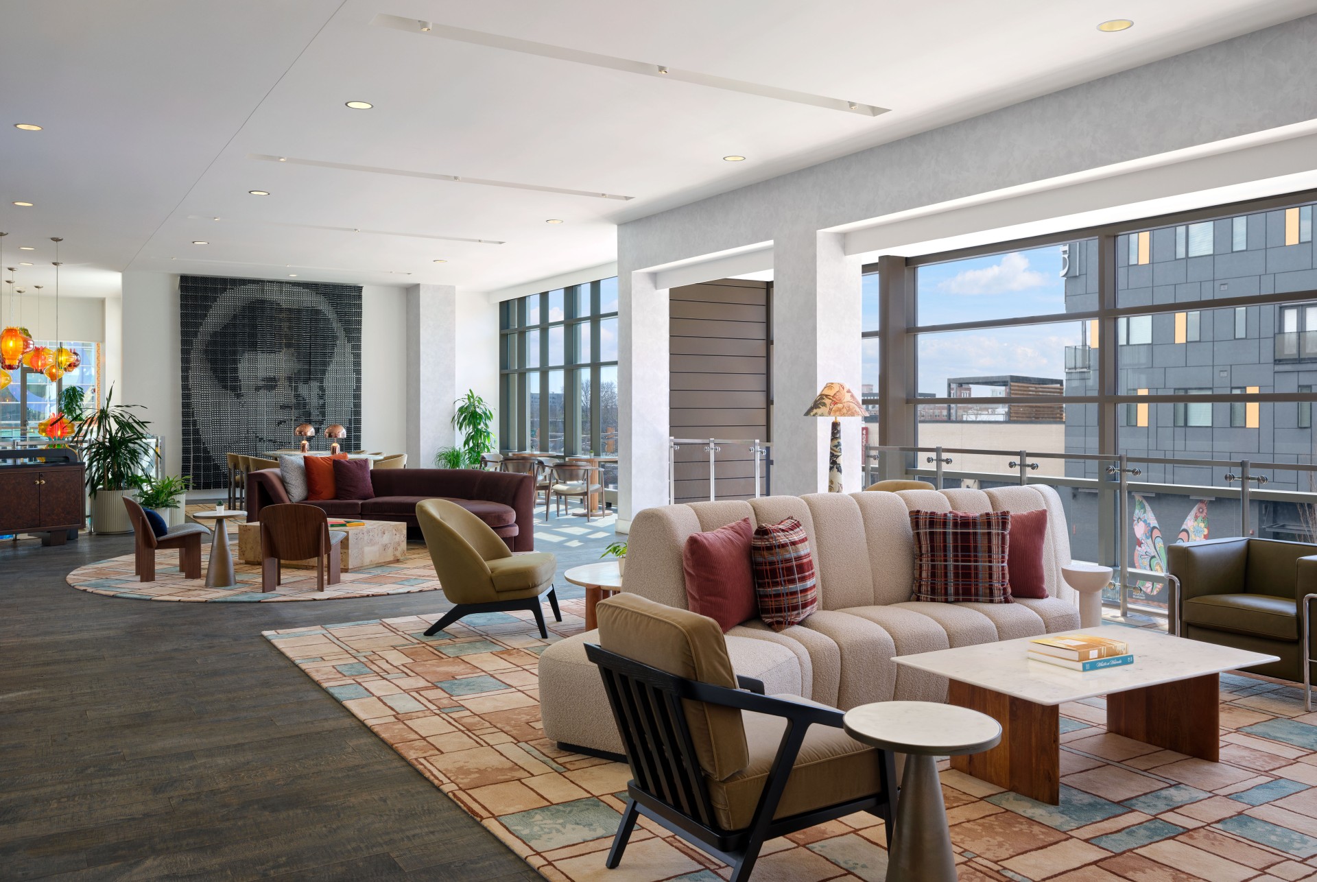 a room with a couch and chairs