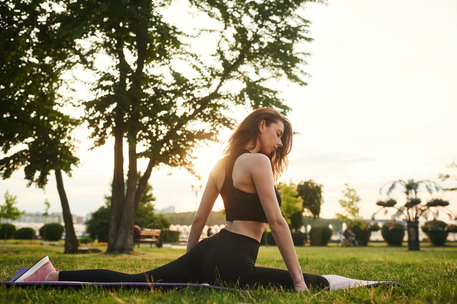 a woman stretching in a park