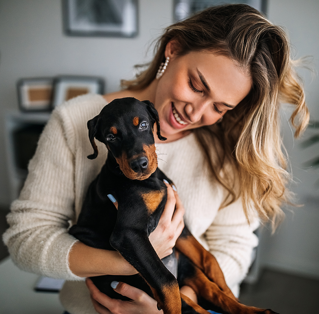 a woman holding a dog