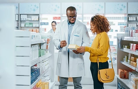 a man and woman in a pharmacy