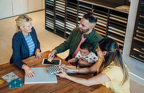 a group of people looking at a computer screen