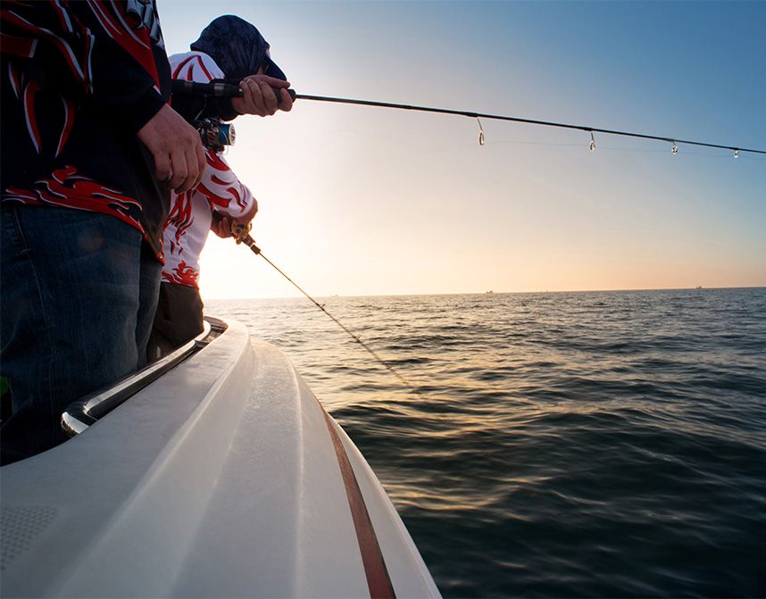 a group of people fishing on a boat