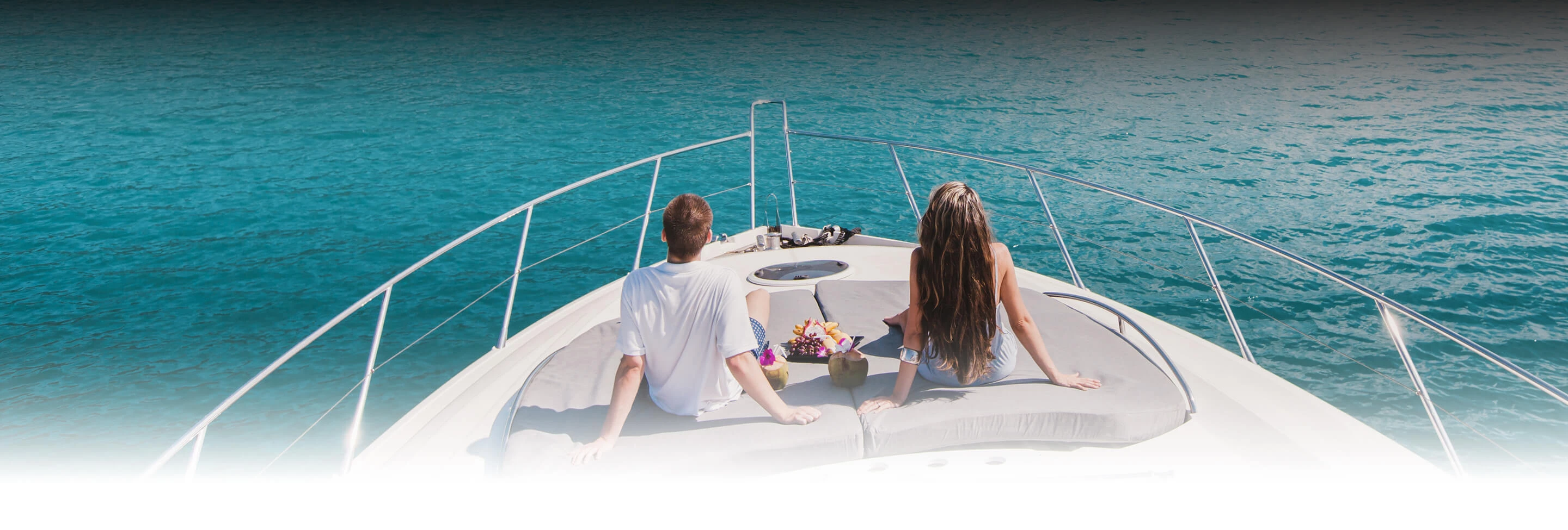 a man and woman sitting on a boat