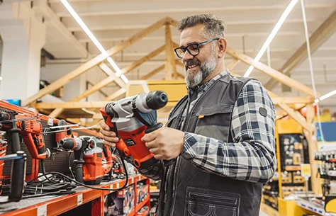a man holding a power drill