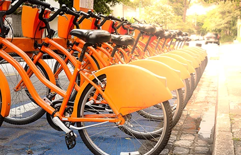 a row of orange bicycles