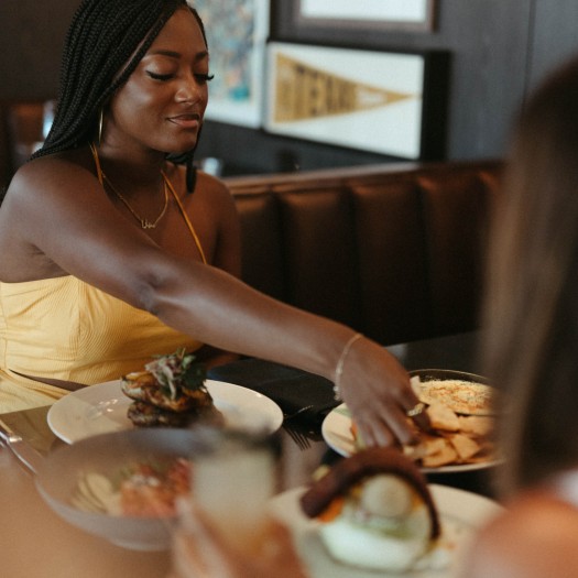 a person eating food at a restaurant