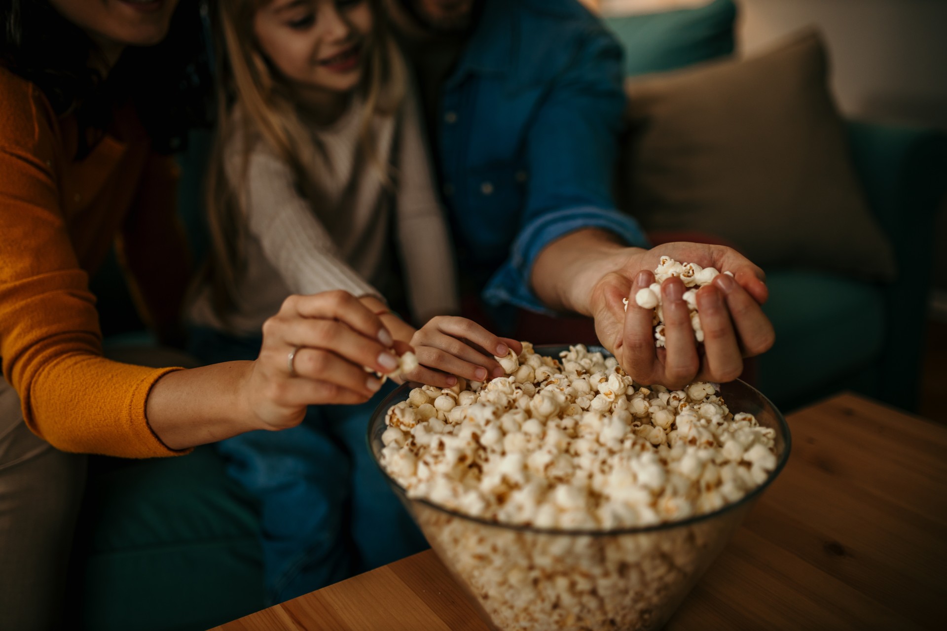 a group of people eating popcorn