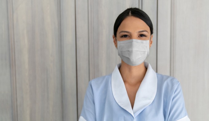 hotel housekeeper with mask