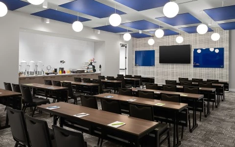 a conference room with tables and chairs