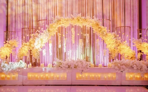 a stage with flowers and candles