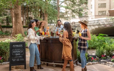 group of people standing outside at bar