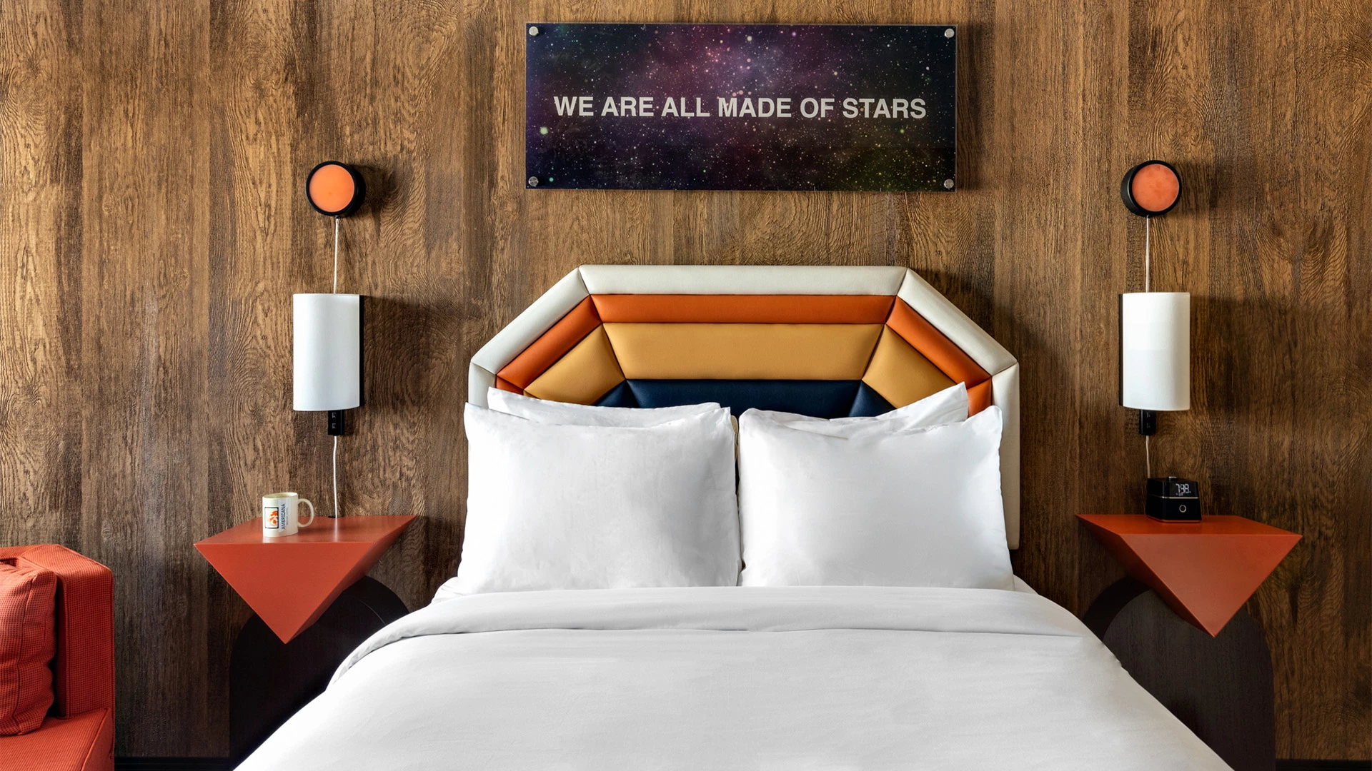 a bed with a large headboard