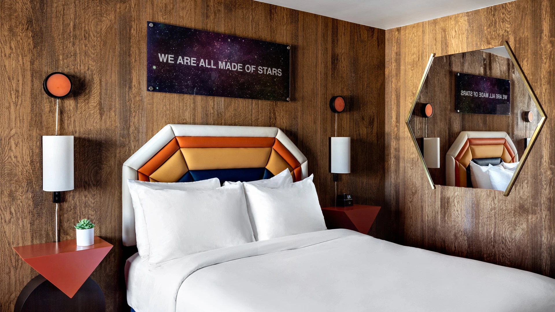 a bed with a large headboard