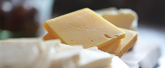 a close-up of a block of cheese