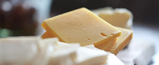 a close-up of a block of cheese