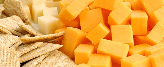 a pile of cheese cubes and chips