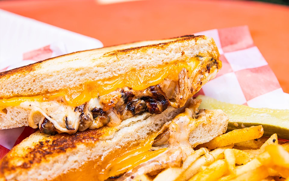 a grilled chicken sandwich with fries