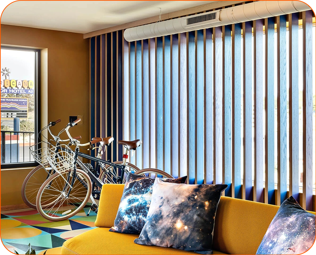 a room with a couch and bicycles