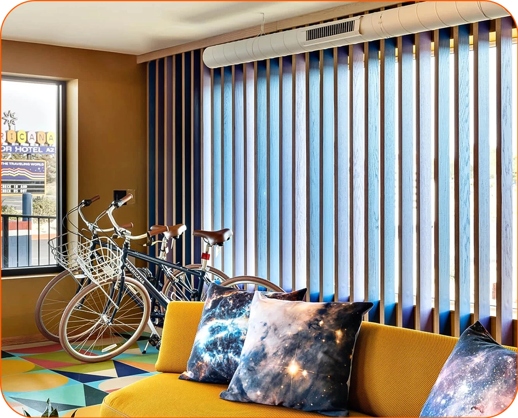a room with a couch and bicycles
