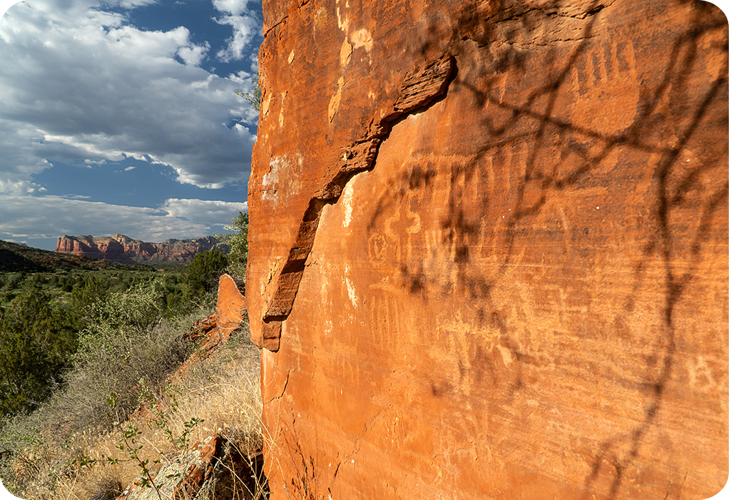 a rock wall with a shadow on it