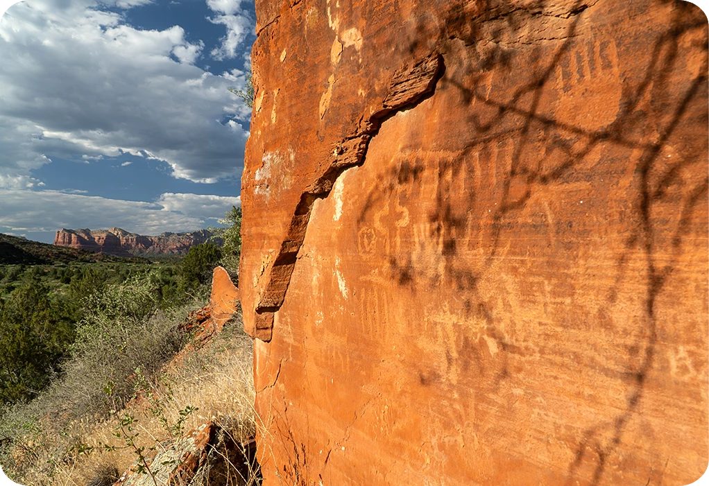 a rock wall with a shadow on it