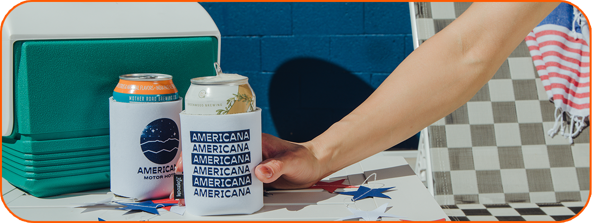 a hand holding a can of beer