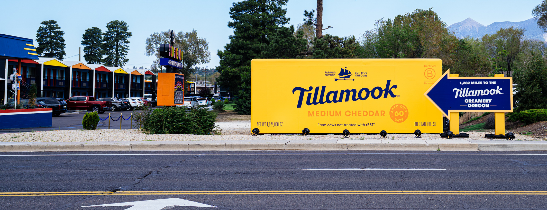 a large yellow sign on the side of a road