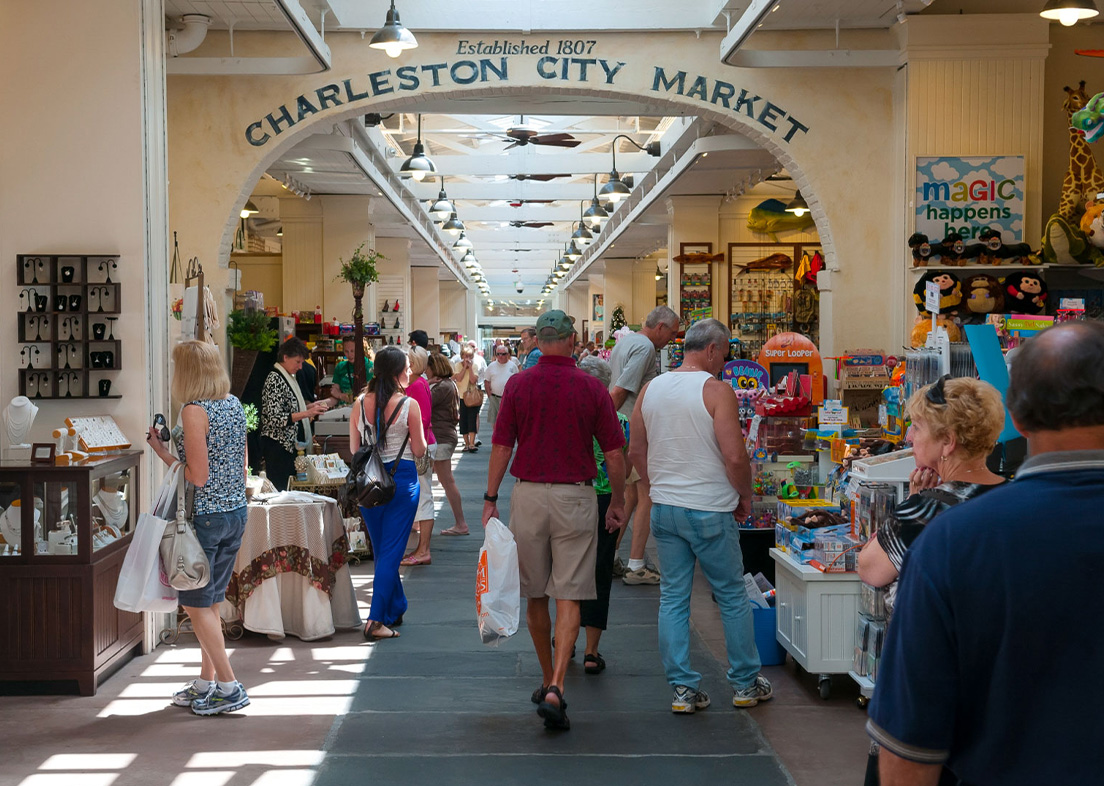 a group of people walking in a market